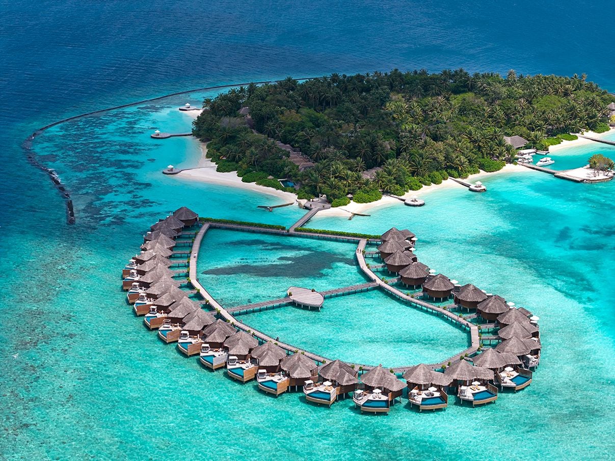 Baros Maldives drone shot with emerald blue reef