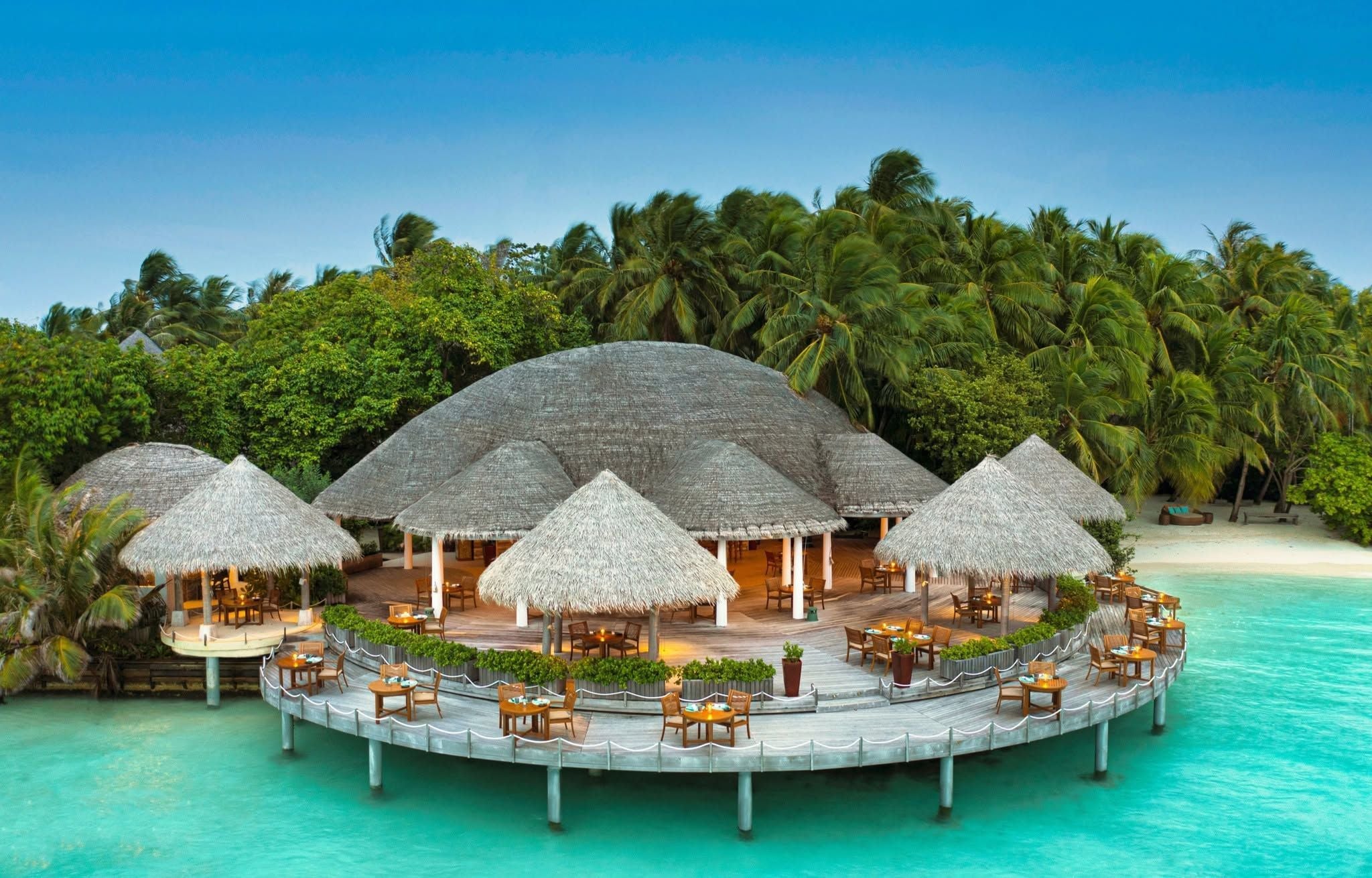 Cayenne Grill, an open thatched pavilion on a deck over the lagoon