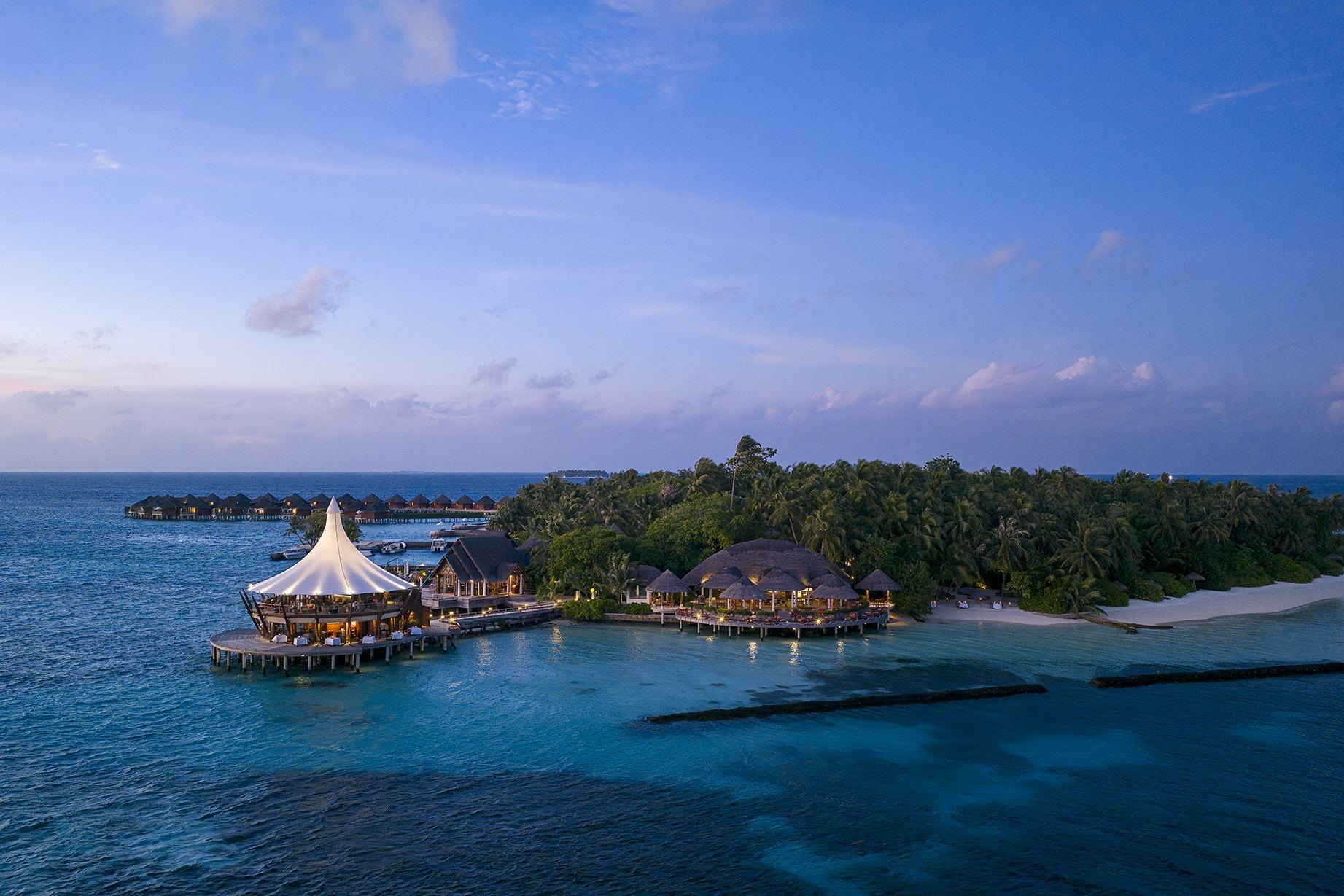 Aerial view of Baros with The Lighthouse over the lagoon
